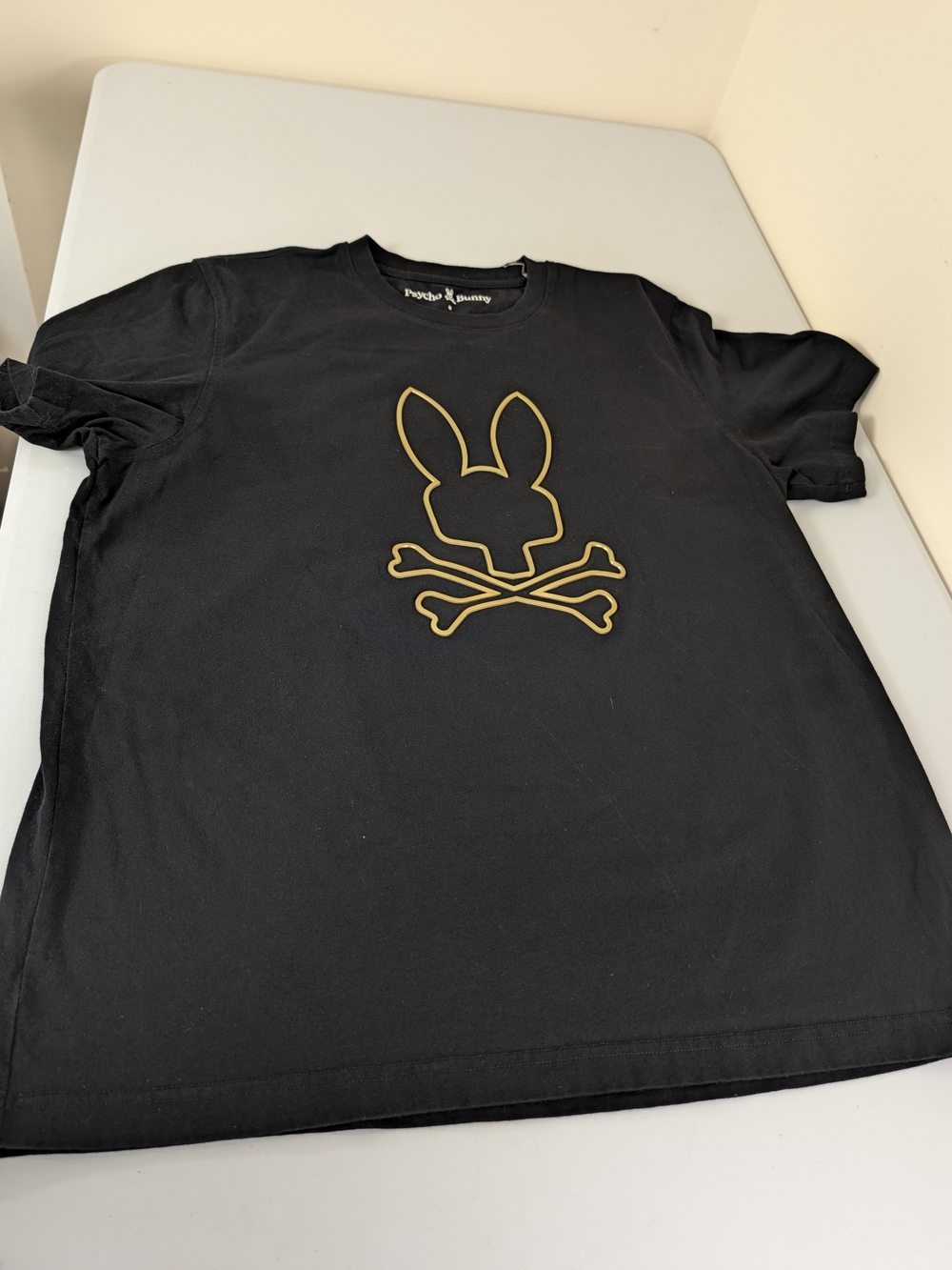 Psycho Bunny Black Tee with Gold Bunny-and-Bones Logo